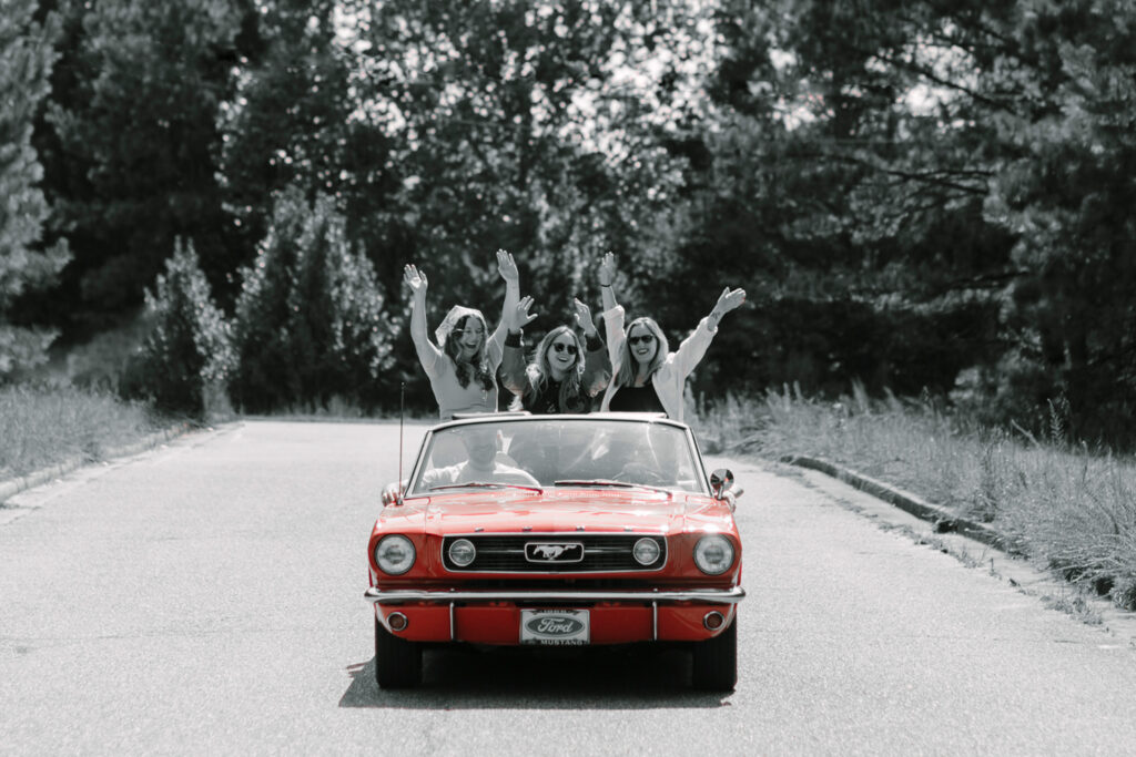 nofo crew in vintage car